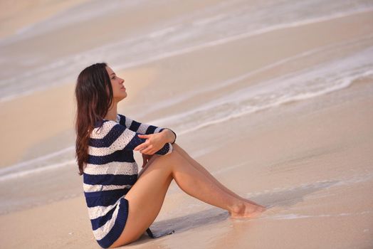 Happy Beautiful Woman Enjoying Summer Vacation on beach