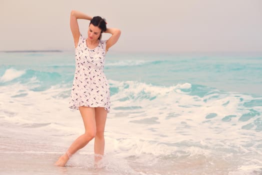 Happy Beautiful Woman Enjoying Summer Vacation on beach