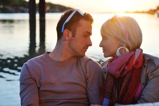 happy young couple in love  have romantic time at summer sunset   at ship boat while  representing urban and countryside fashin lifestyle