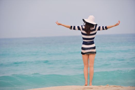 Happy Beautiful Woman Enjoying Summer Vacation on beach