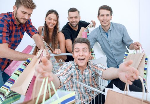 close up.happy group of friends shopping.sale concept