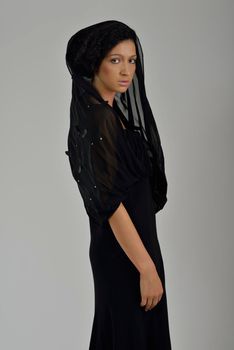 elegant woman in  fashionable  stylish dress posing in the studio