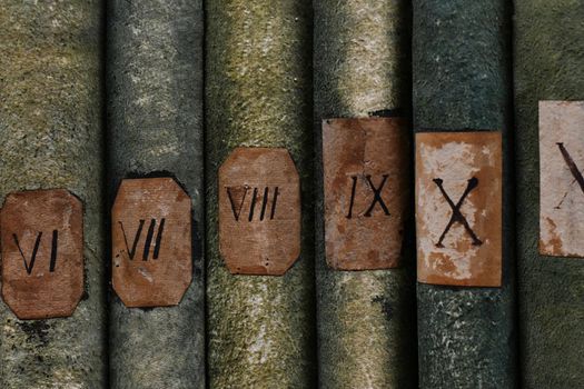 Old books with Roman numerals in the library archive