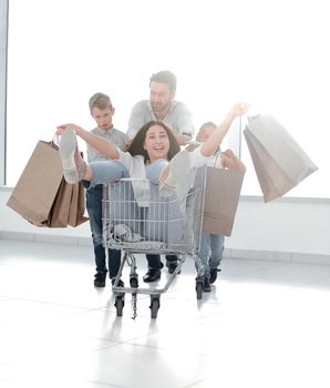 cheerful family goes shopping in a hypermarket. photo with copy space