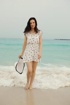 Happy Beautiful Woman Enjoying Summer Vacation on beach