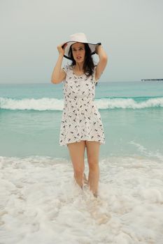 Happy Beautiful Woman Enjoying Summer Vacation on beach