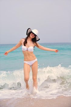 beautifel and happy woman girl on beach have fun and relax on summer vacation  over the beautiful tropical sea