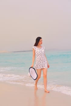 Happy Beautiful Woman Enjoying Summer Vacation on beach