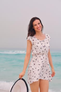 Happy Beautiful Woman Enjoying Summer Vacation on beach