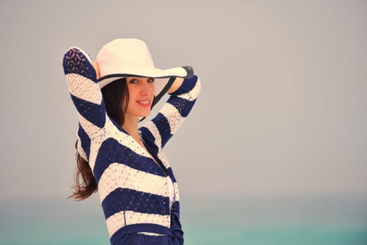 Happy Beautiful Woman Enjoying Summer Vacation on beach