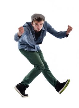 young boy man teen dancing and jumping isolated on white background in studio