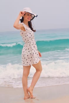 Happy Beautiful Woman Enjoying Summer Vacation on beach