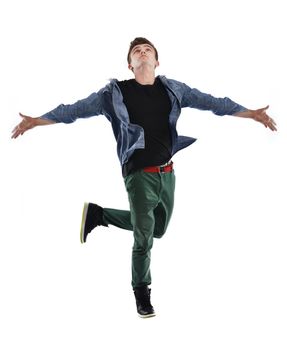 young boy man teen dancing and jumping isolated on white background in studio