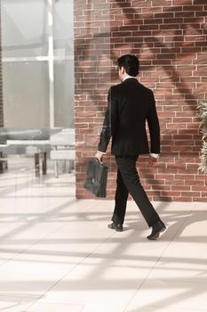 businessman walks in his office.business concept