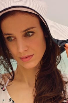 portrait of happy young woman on beach at summer vacation