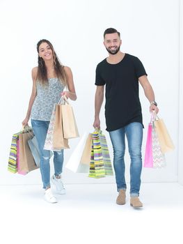 Couple with shopping bags, isolated on white background