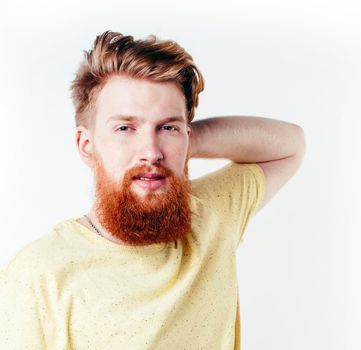 young handsome hipster ginger bearded guy looking brutal isolated on white background, lifestyle people concept close up