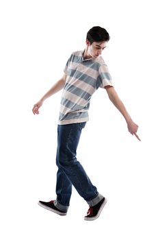 young boy man teen dancing and jumping isolated on white background in studio