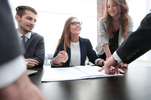 Businesswoman standing and leading business presentation.