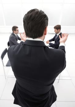 rear view.businessman holds a working meeting.business concept