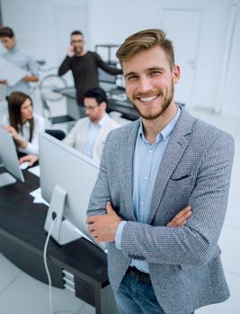 young businessman standing in a modern office.business people