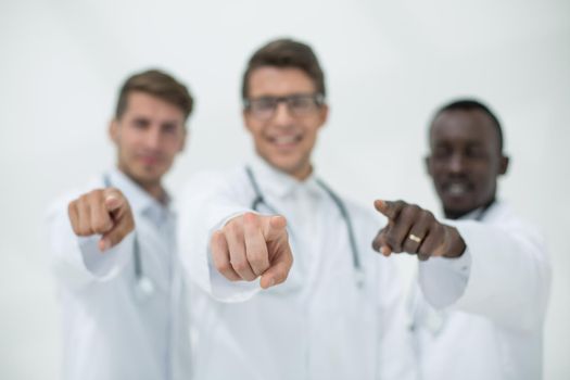 blurry image of a group of doctors pointing at you. the concept of choice