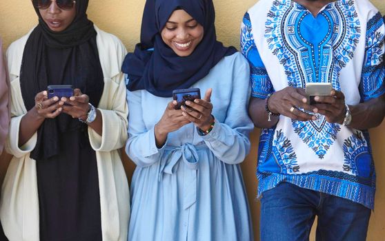 multiethnic students group on break using smart phones