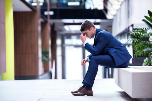 frustrated young business man working on laptop computer at office