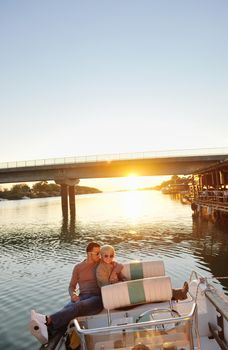 happy young couple in love  have romantic time at summer sunset   at ship boat while  representing urban and countryside fashin lifestyle