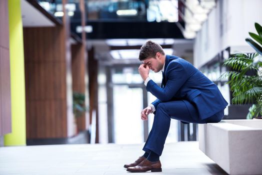 frustrated young business man working on laptop computer at office