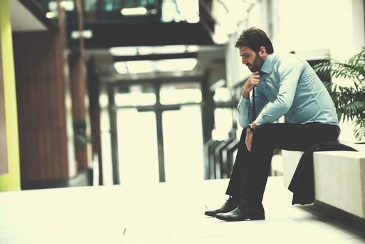 frustrated young business man working on laptop computer at office