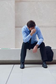 frustrated young business man working on laptop computer at office