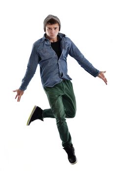 young boy man teen dancing and jumping isolated on white background in studio