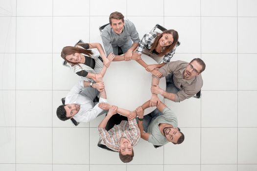 top view.single business team sitting at the round table.the concept of teamwork