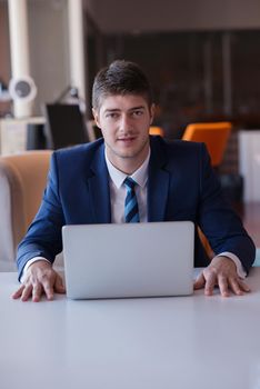 happy young business man portrait in bright modern office indoor