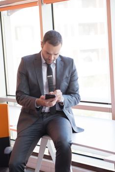 happy young business man portrait in bright modern office indoor