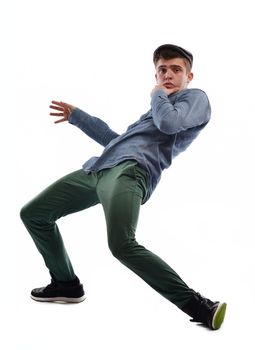 young boy man teen dancing and jumping isolated on white background in studio