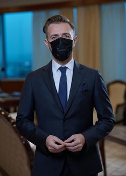 corporate business man wearing protective medical face mask at luxury office