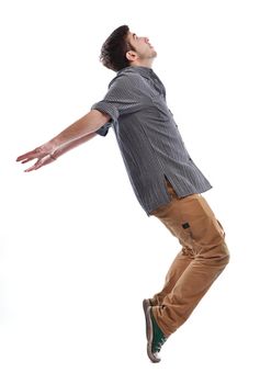 young boy man teen dancing and jumping isolated on white background in studio