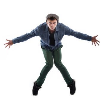 young boy man teen dancing and jumping isolated on white background in studio