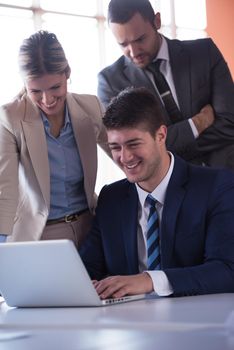 happy young business man portrait in bright modern office indoor