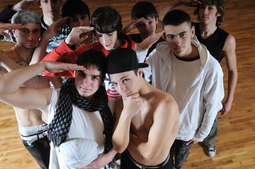 group of young happy boys posing  together in dence studio