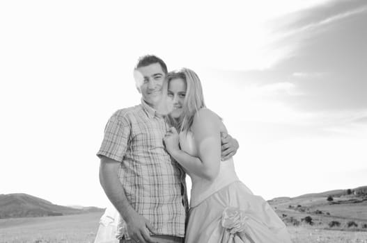 happy bride and groom walking and run on beautiful meadow outdoor at sunset