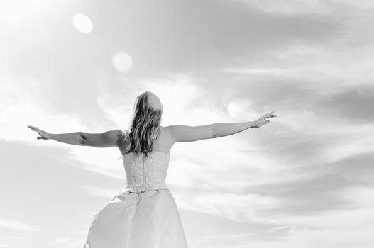 happy young beautiful bride after wedding ceremony event have fun outdoor on meadow at sunset