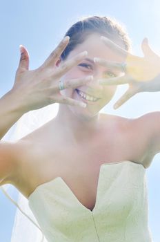 happy young beautiful bride after wedding ceremony event have fun outdoor on meadow at sunset