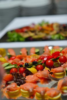 people group catering buffet food indoor in luxury restaurant with meat colorful fruits  and vegetables