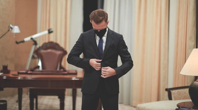 corporate business man wearing protective medical face mask at luxury office