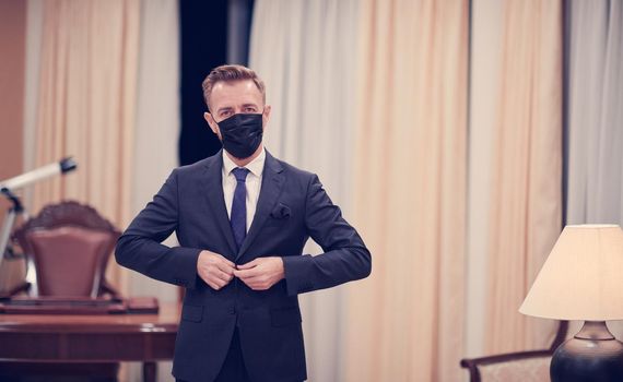 corporate business man wearing protective medical face mask at luxury office