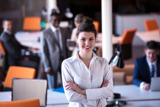 business woman with her staff, people group in background at modern bright office indoors