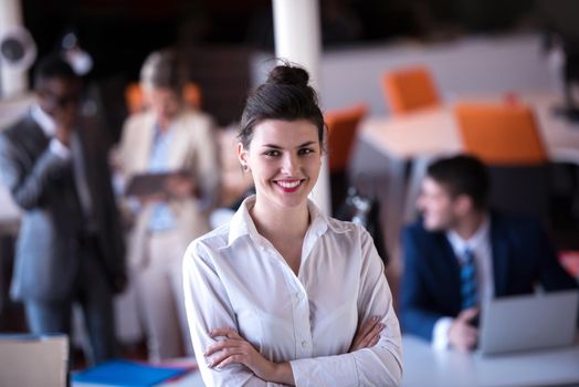 business woman with her staff, people group in background at modern bright office indoors